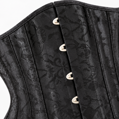 Detalle de Corset de cintura negro con cordones y broches